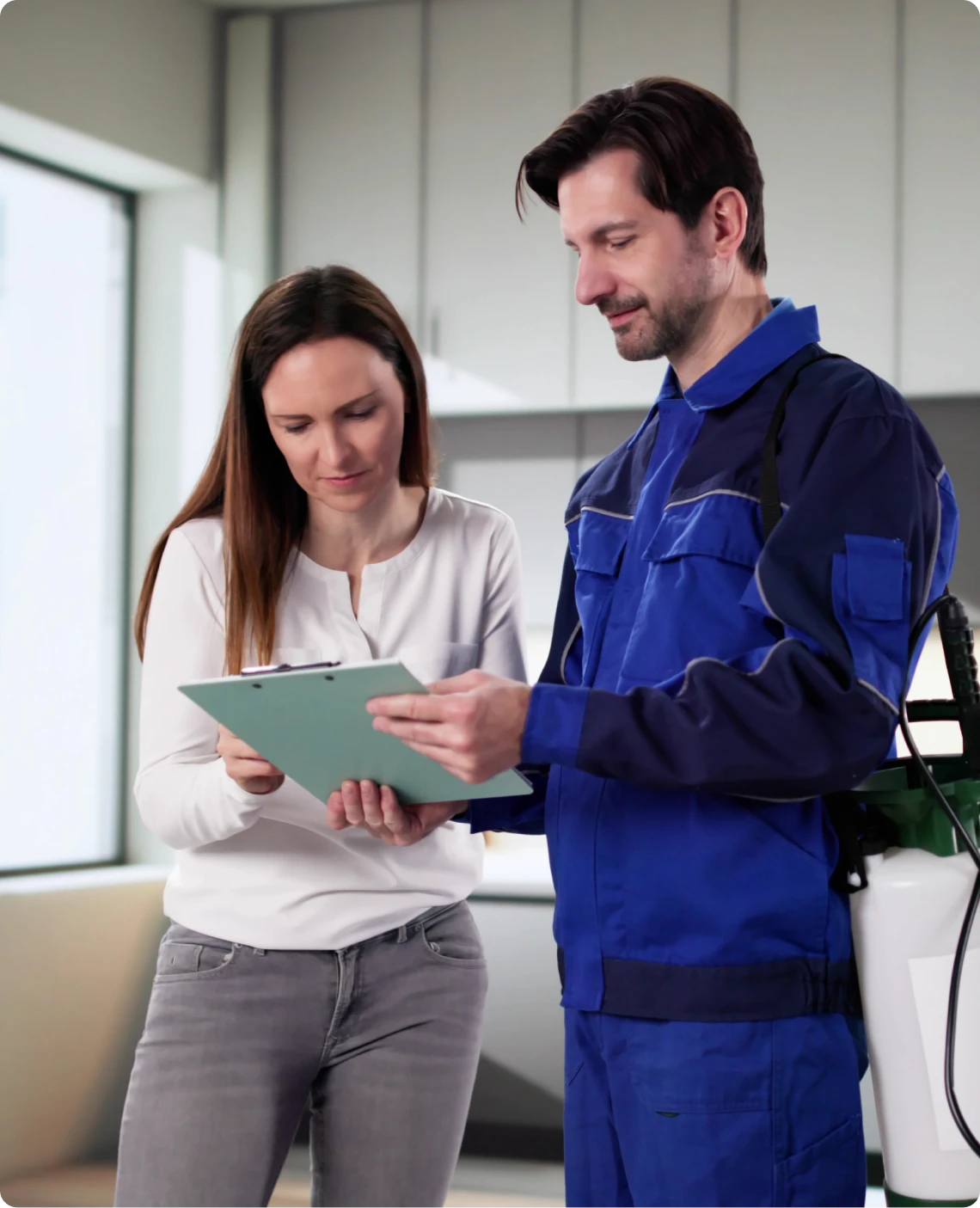 Pest control worker showing paperwork